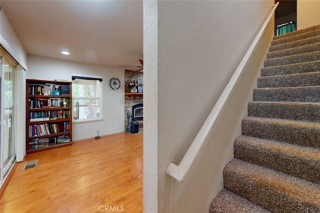 staircase featuring wood-type flooring