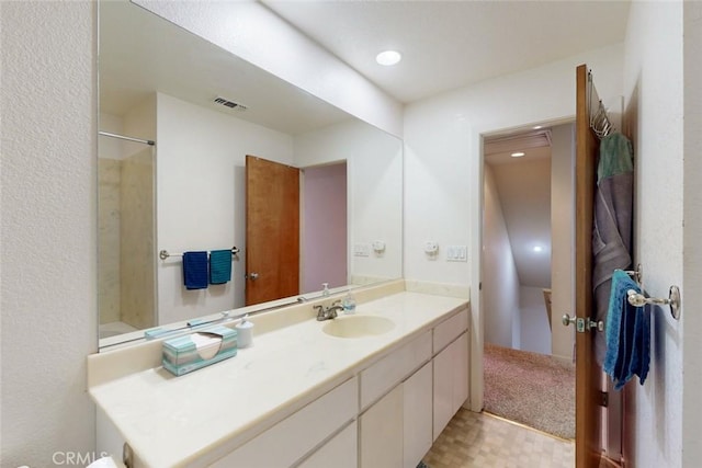 bathroom with vanity and walk in shower