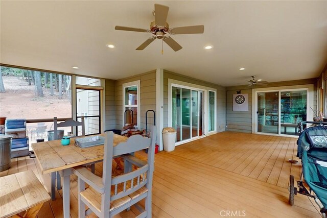 sunroom / solarium with ceiling fan