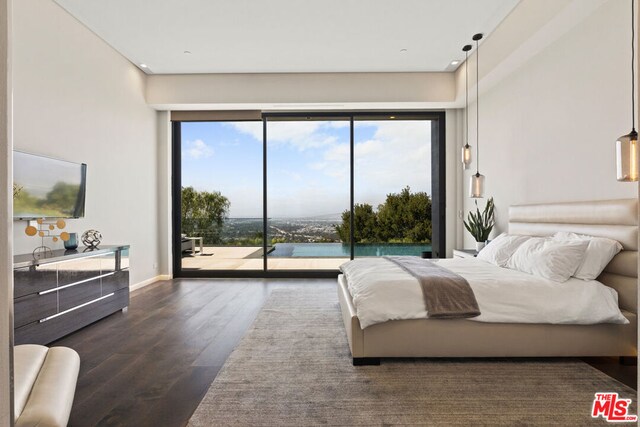 bedroom with dark hardwood / wood-style flooring and access to outside