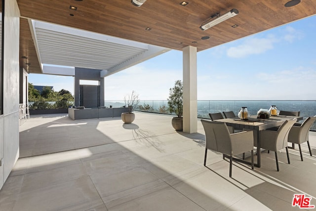 view of patio / terrace featuring a water view