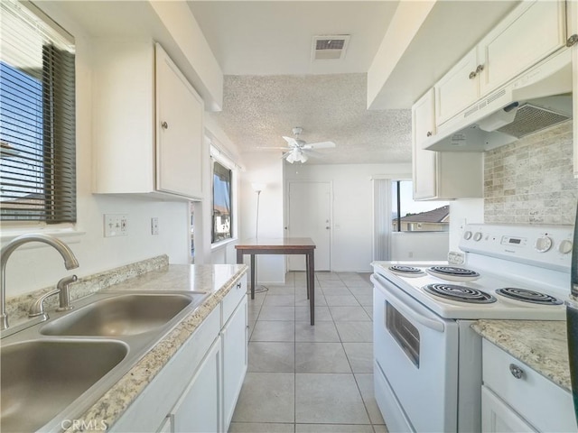 kitchen featuring white cabinetry, sink, ceiling fan, white range with electric cooktop, and a textured ceiling