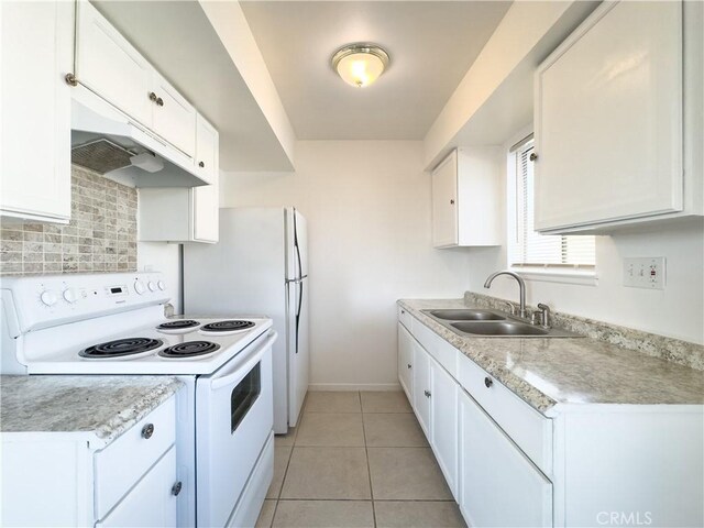 kitchen with light tile patterned flooring, sink, white cabinetry, white range with electric cooktop, and decorative backsplash