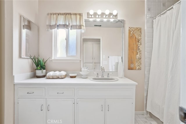 bathroom with a shower with curtain and vanity