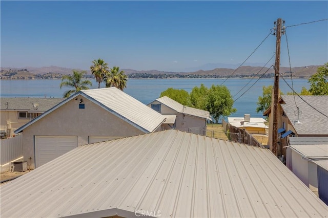 exterior space featuring a water and mountain view and cooling unit