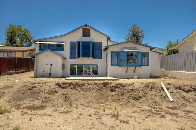 back of house featuring a patio area