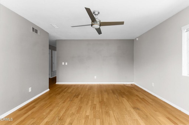 unfurnished room featuring light wood-type flooring and ceiling fan