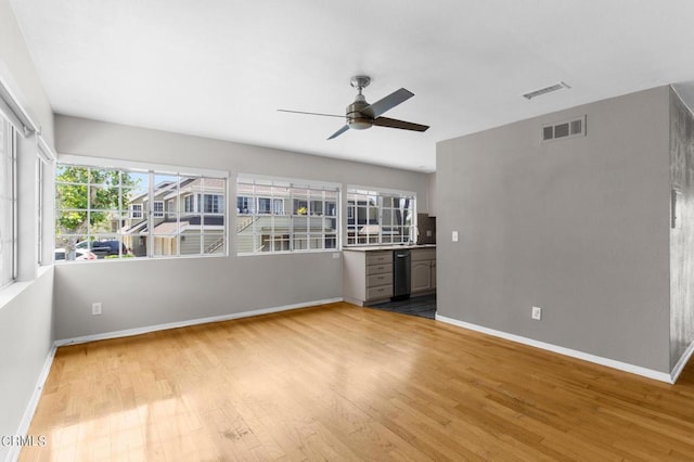 interior space featuring wood-type flooring and ceiling fan