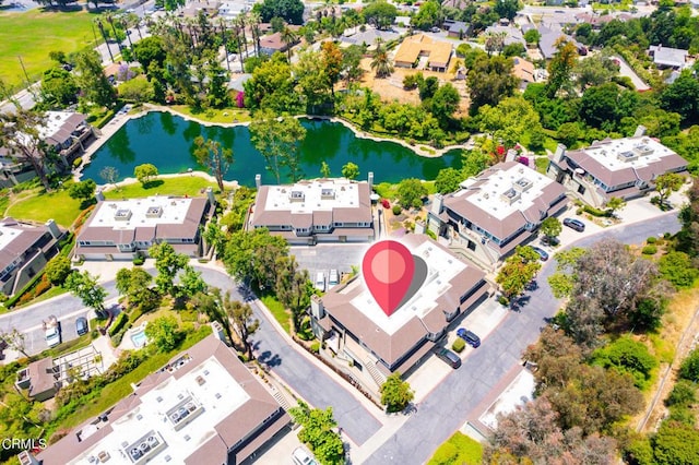 birds eye view of property with a water view