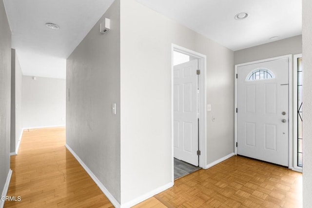 entrance foyer featuring light parquet flooring