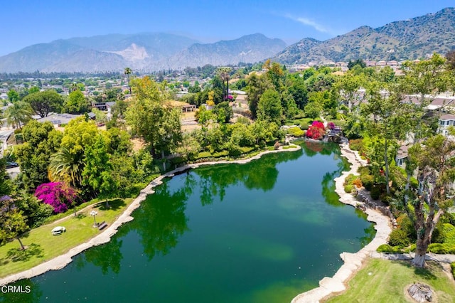 aerial view featuring a water and mountain view