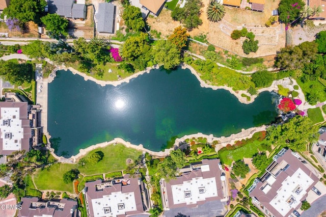 birds eye view of property featuring a water view