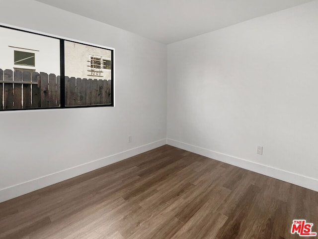 unfurnished room featuring hardwood / wood-style floors