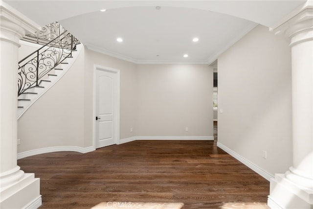 basement with dark hardwood / wood-style floors and crown molding