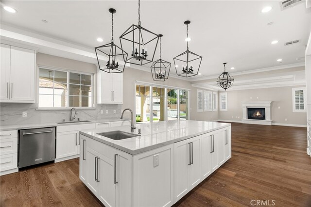 kitchen with white cabinetry, sink, stainless steel dishwasher, and dark hardwood / wood-style floors