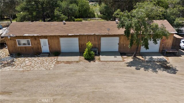 single story home featuring a garage