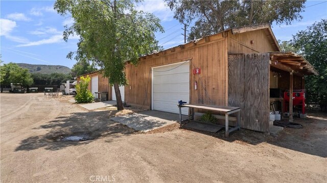 exterior space featuring a mountain view and a garage