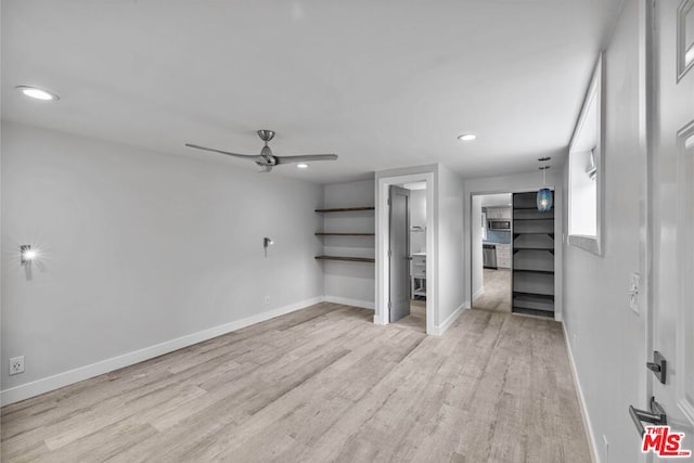 interior space featuring ceiling fan and light hardwood / wood-style floors