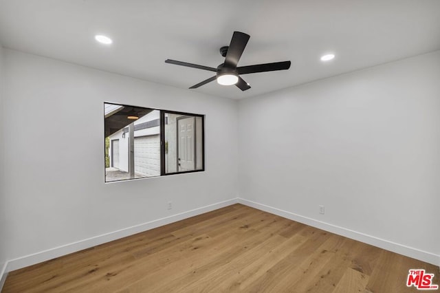 unfurnished room featuring light wood-type flooring and ceiling fan