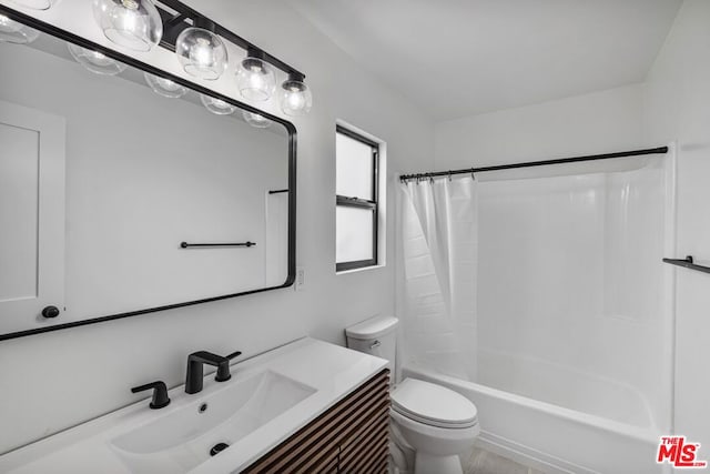 full bathroom featuring shower / bath combination with curtain, vanity, and toilet