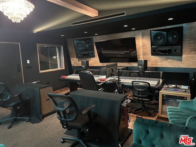 carpeted office with vaulted ceiling with beams and an inviting chandelier