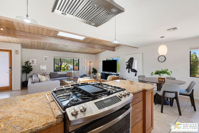 kitchen featuring pendant lighting, light tile patterned floors, lofted ceiling with beams, and stainless steel range with gas stovetop