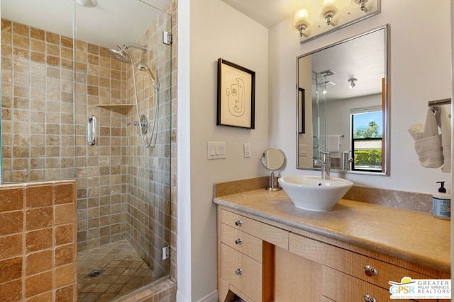 bathroom with vanity and an enclosed shower