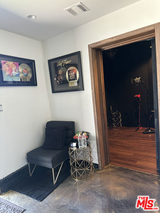 sitting room featuring dark hardwood / wood-style flooring