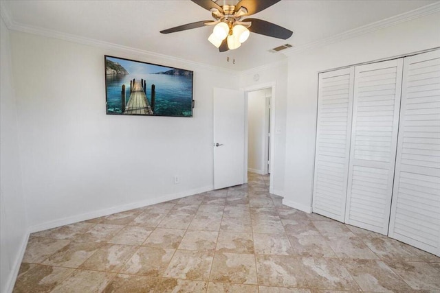 unfurnished bedroom featuring ornamental molding, ceiling fan, and a closet