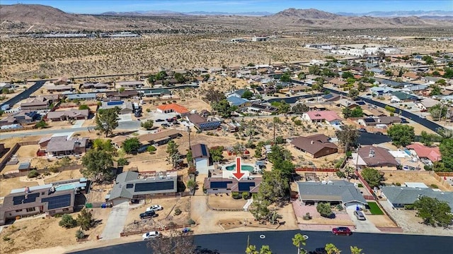 birds eye view of property featuring a mountain view