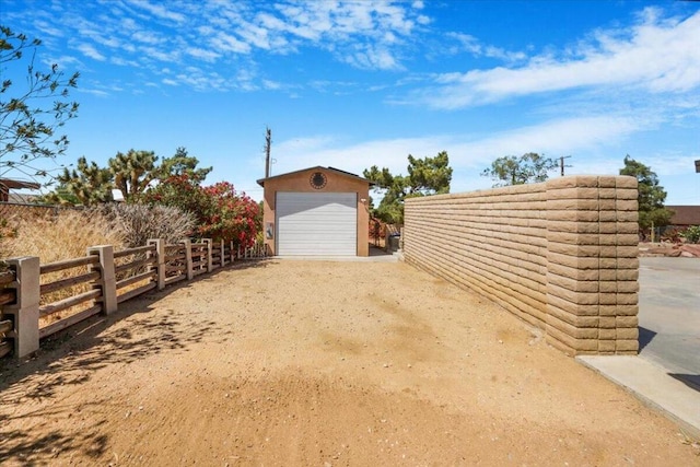 exterior space featuring an outdoor structure and a garage