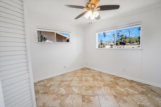 empty room with ornamental molding and ceiling fan