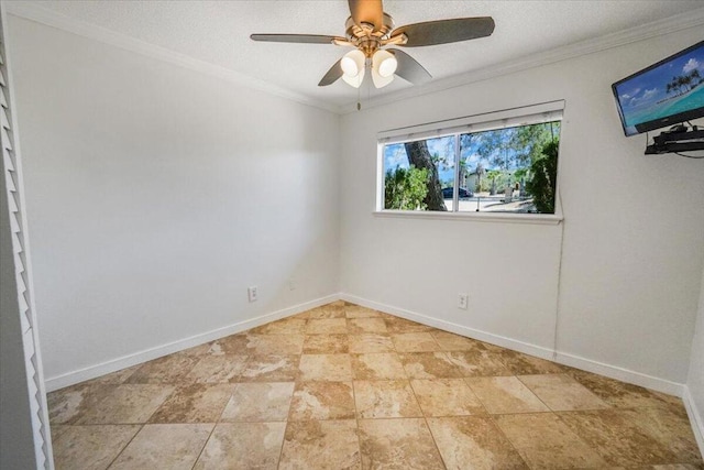 spare room featuring ceiling fan and ornamental molding