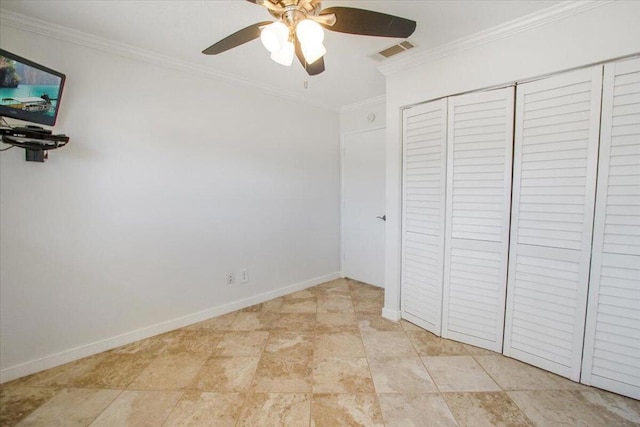 unfurnished bedroom with ceiling fan, a closet, and ornamental molding