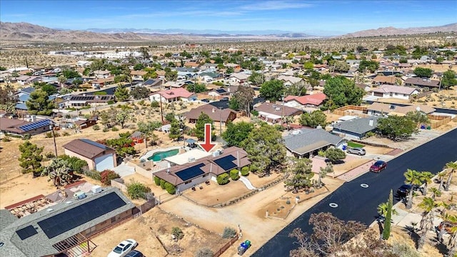 birds eye view of property with a mountain view