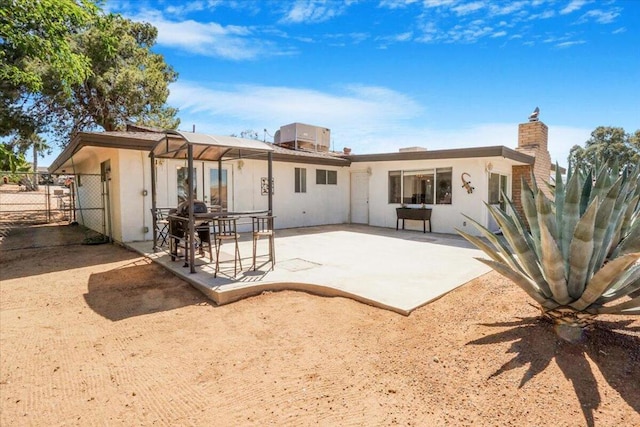 back of property with a patio area