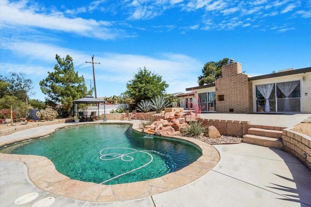 view of pool with a gazebo and a patio