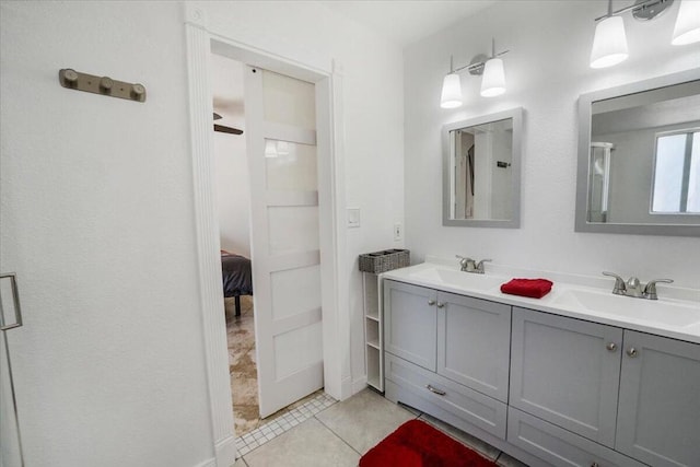 bathroom with tile patterned flooring and vanity