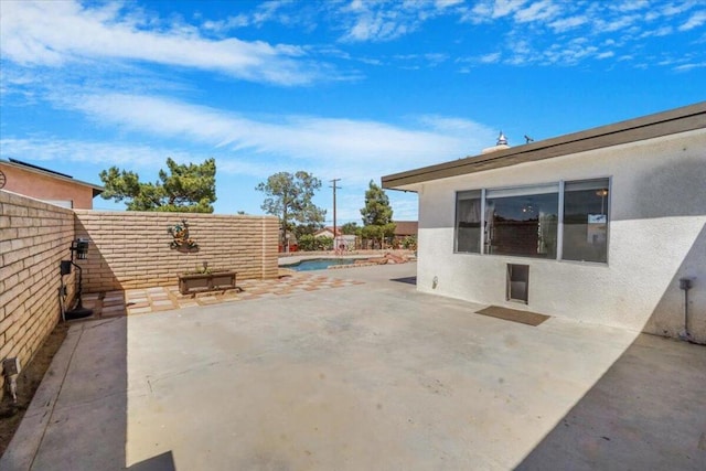 view of patio / terrace featuring a fenced in pool