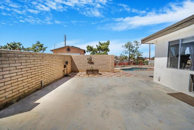 view of patio featuring a fenced in pool