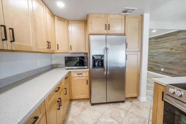 kitchen featuring appliances with stainless steel finishes, light tile patterned flooring, and light brown cabinetry