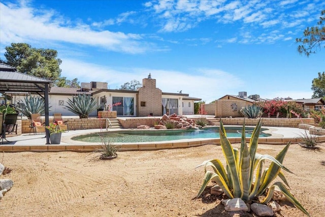 view of swimming pool with a patio area and a gazebo