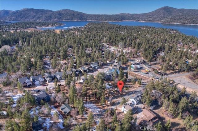 birds eye view of property featuring a water and mountain view