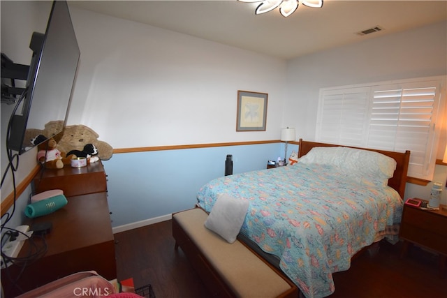 bedroom featuring dark hardwood / wood-style floors