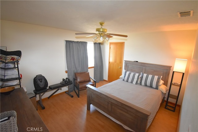 bedroom featuring light wood-type flooring and ceiling fan