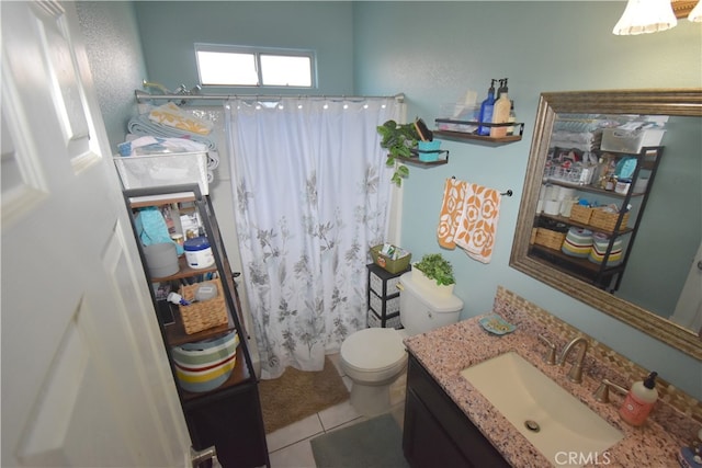 bathroom with walk in shower, vanity, toilet, and tile patterned floors