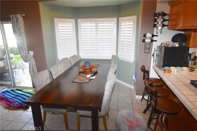 dining space with light tile patterned floors