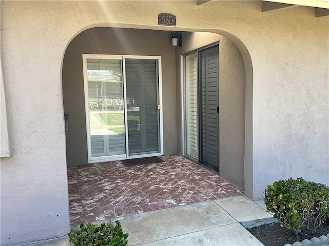 doorway to property featuring a patio