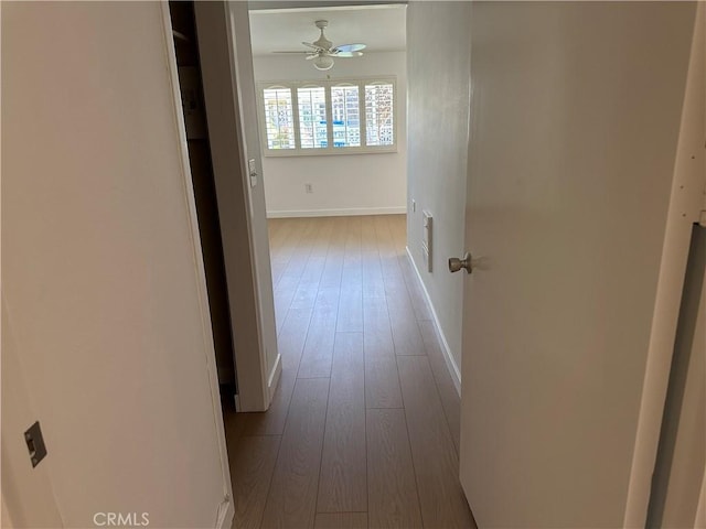 hall with light hardwood / wood-style floors