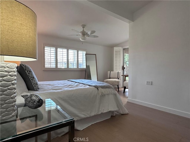 bedroom with hardwood / wood-style flooring, vaulted ceiling, and ceiling fan